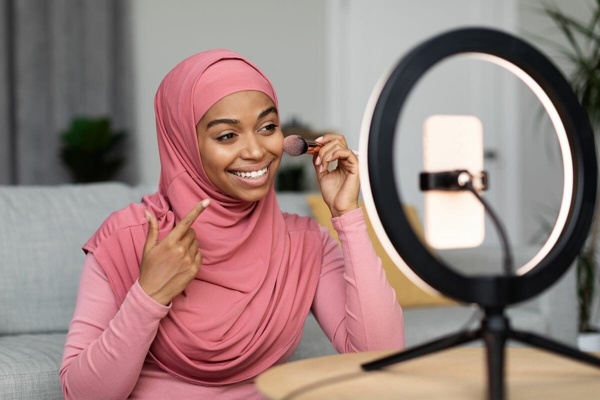 cheerful black muslim woman recording cosmetics pr 2023 02 21 03 41 25 utc pulung.net